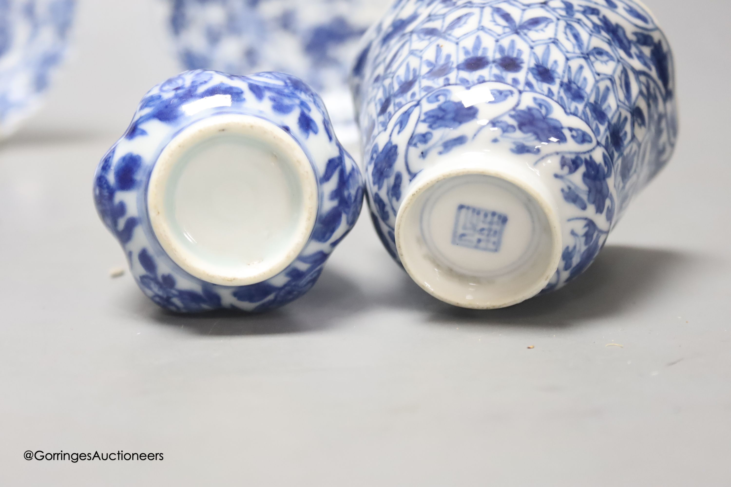 A Chinese blue and white plate 13cm diameter, a similar tea bowl and saucer, Kangxi period and a 19th century Chinese blue and white bottle vase